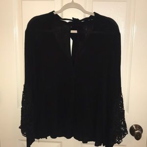 Long sleeve black blouse.